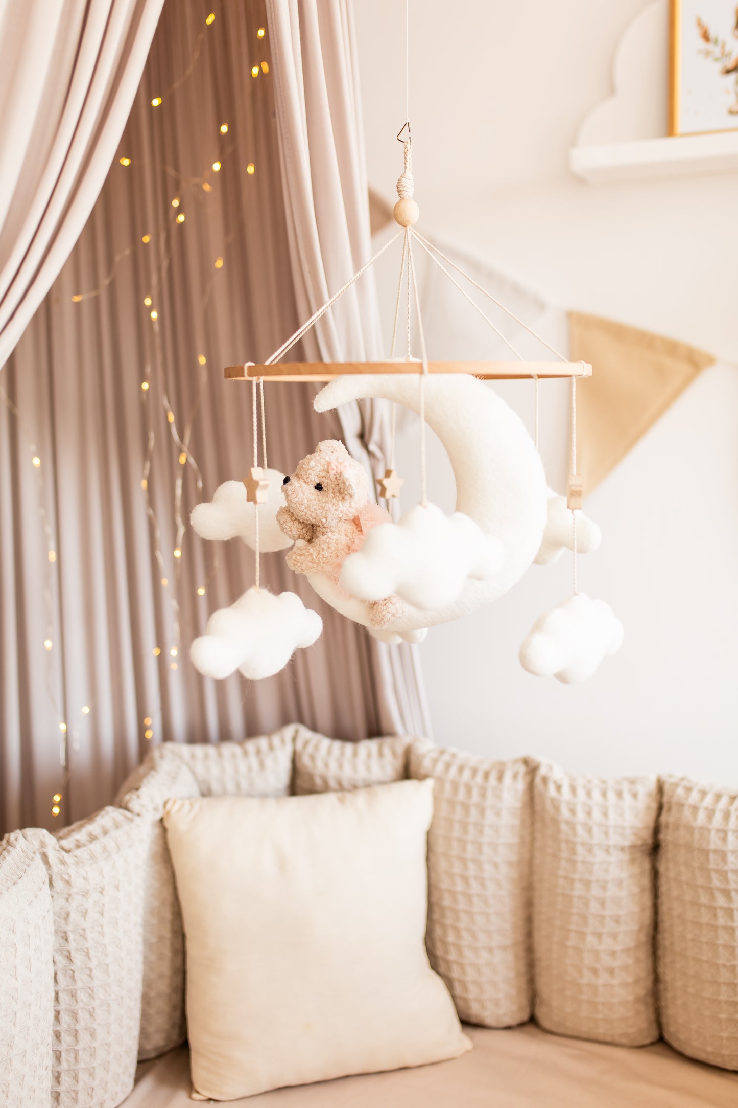 Handmade boucle bear baby mobile in soft pastel nursery decor