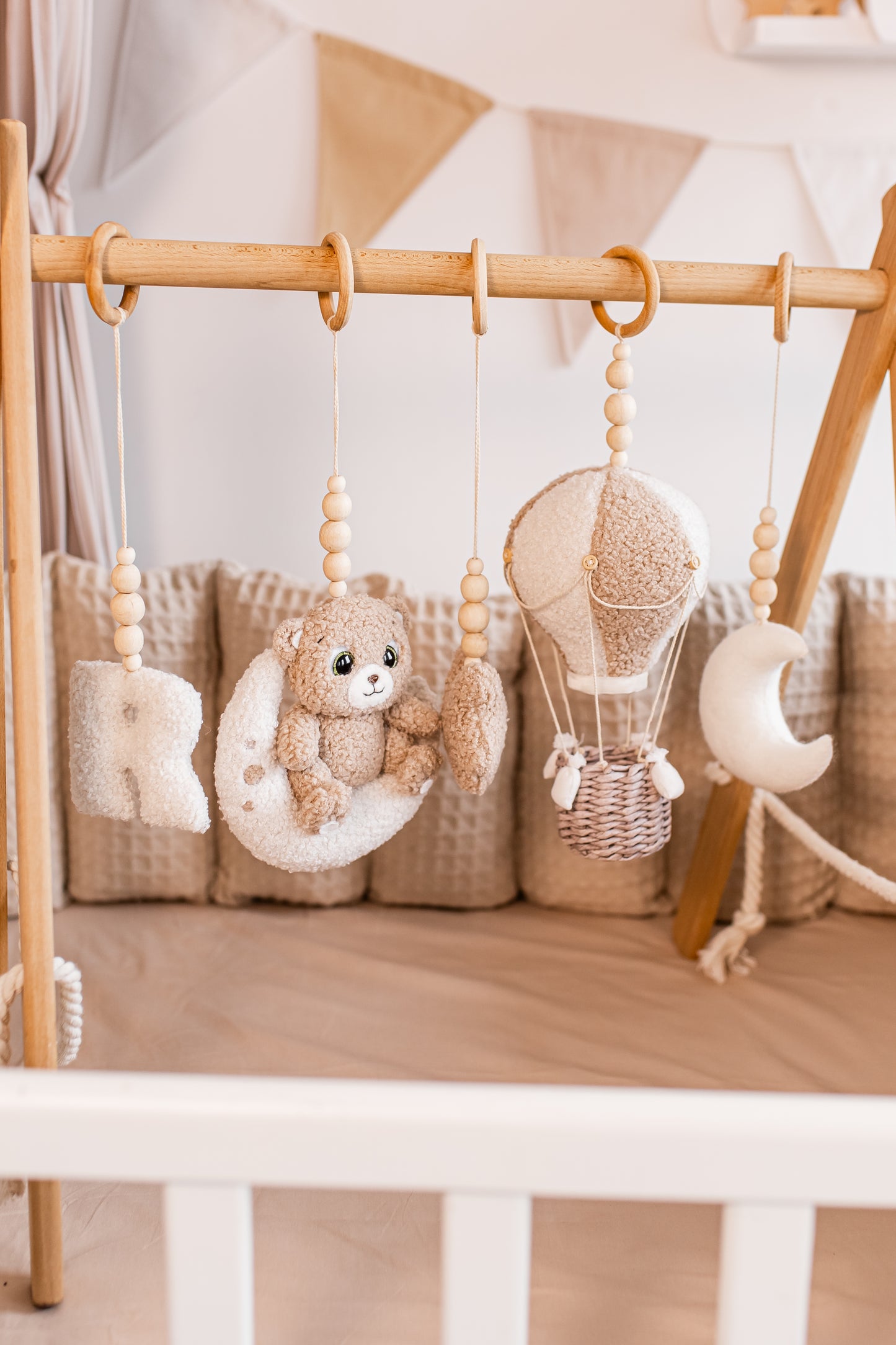 Boucle baby gym with different animal soft toys.