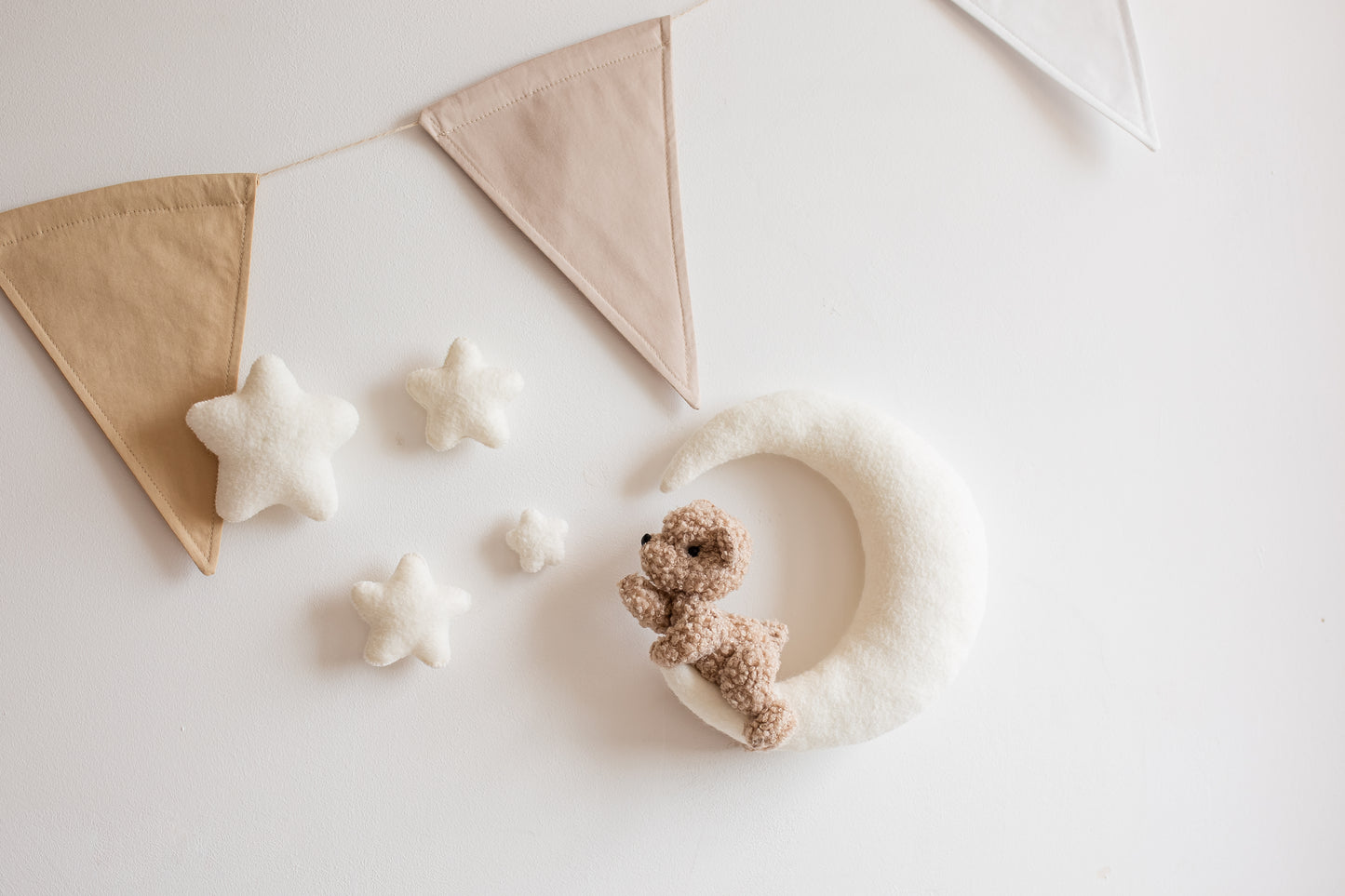 Handmade bouclé teddy bear on moon nursery wall decoration with Velcro mounting