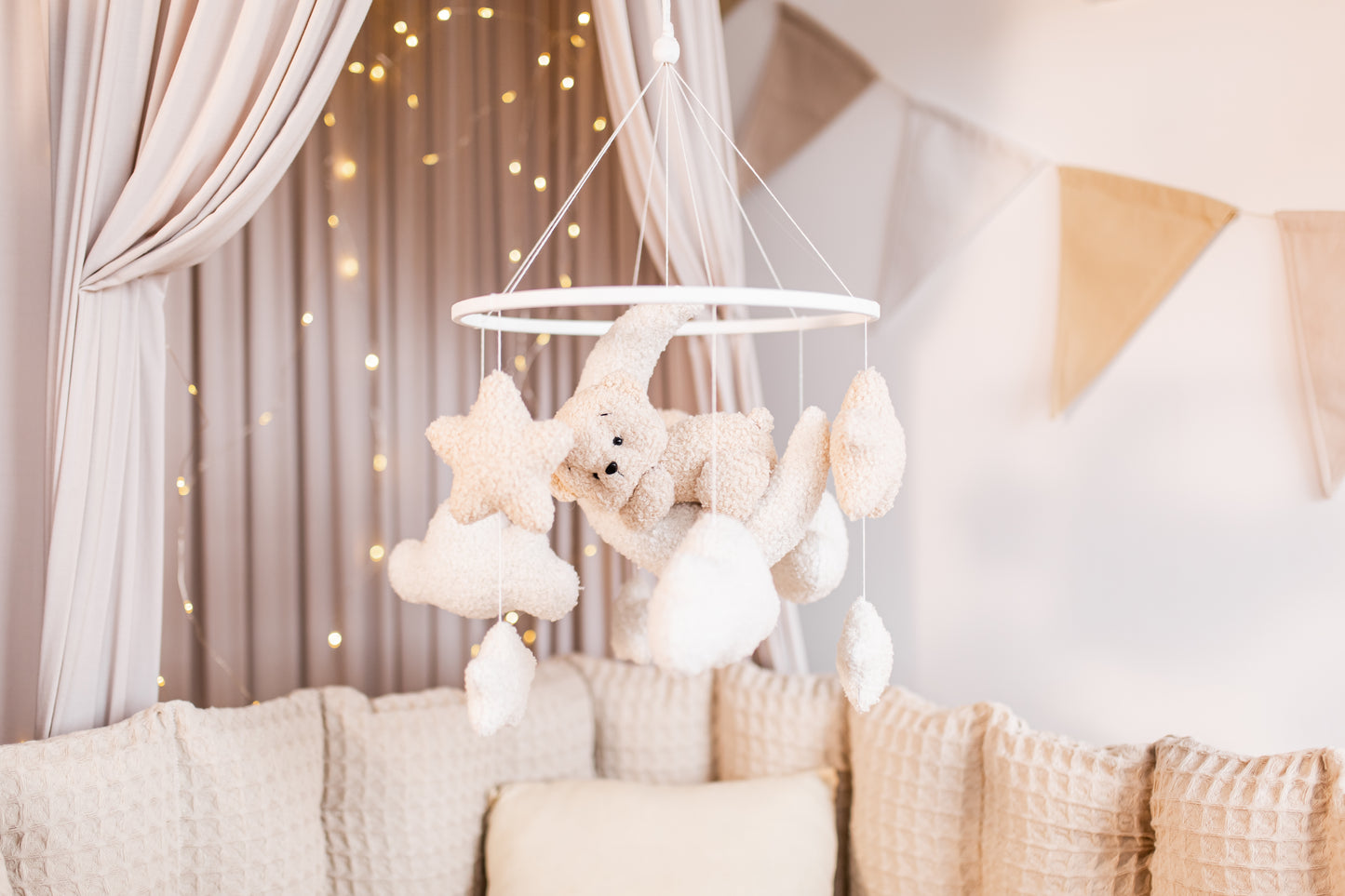 Eco-friendly mobile featuring crescent moon, stars, and clouds for serene nursery decor