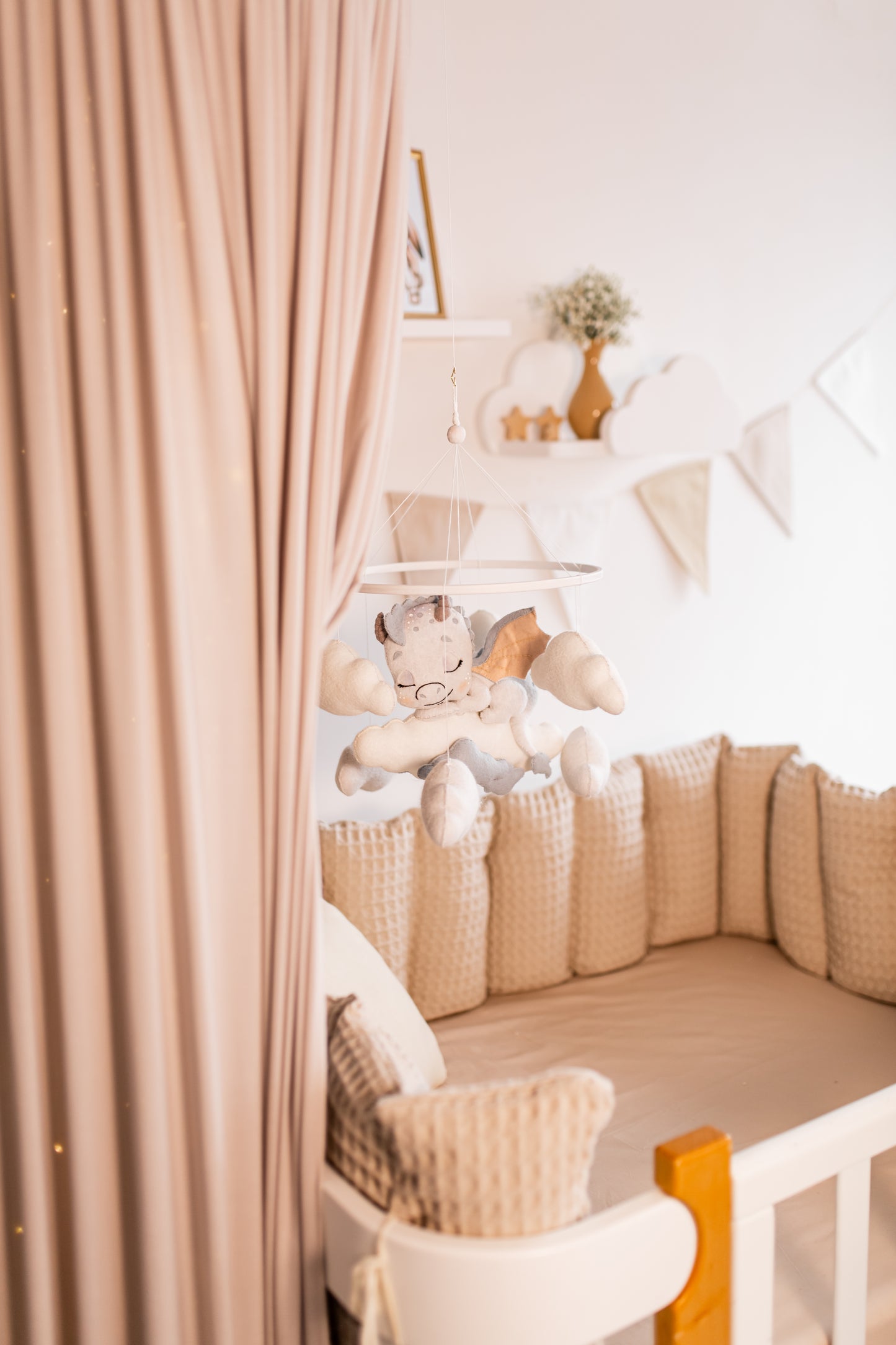 Nursery room with crib, stuffed animal, and decorative elements.
