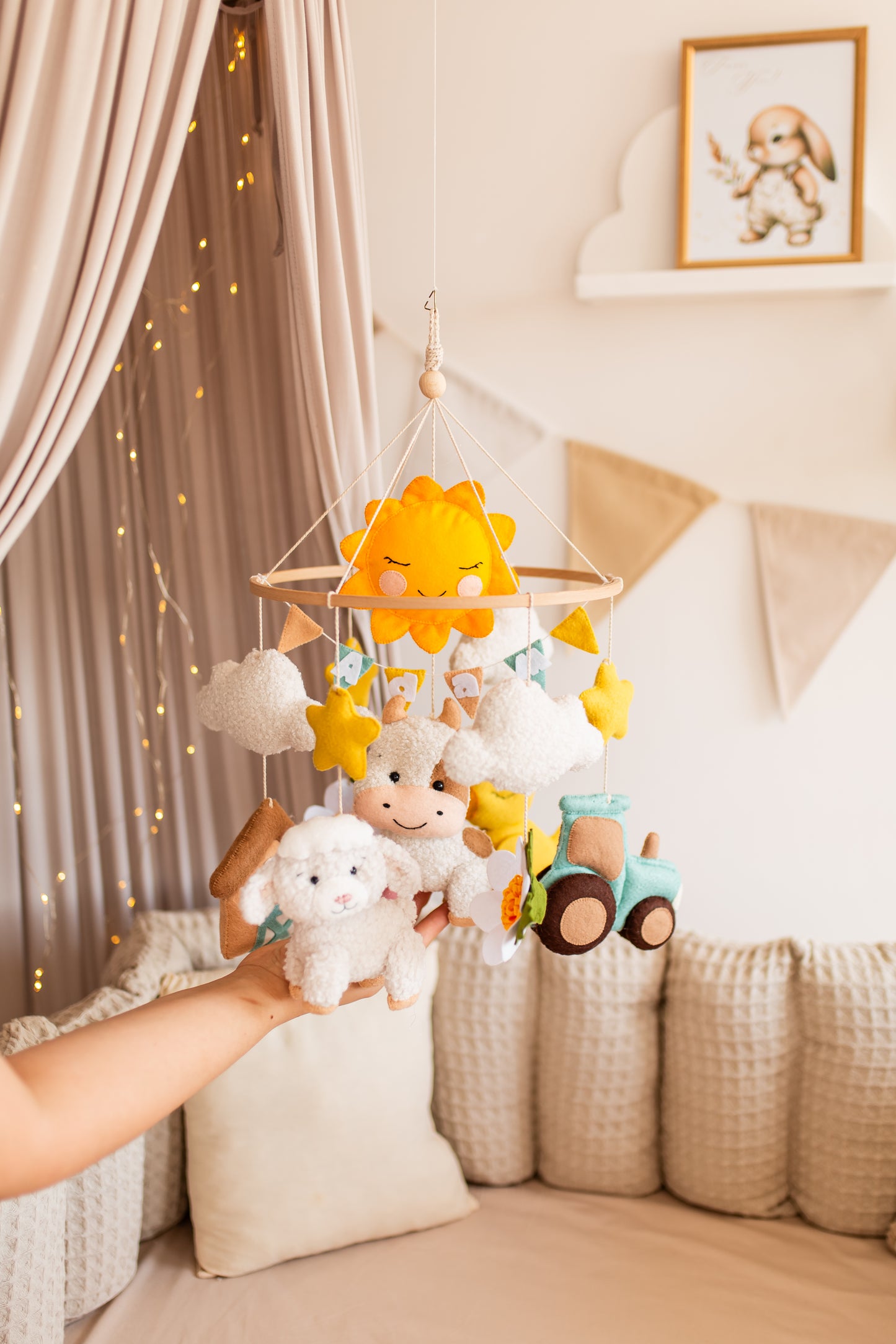 Handmade boucle animal mobile in natural tones for rustic nursery