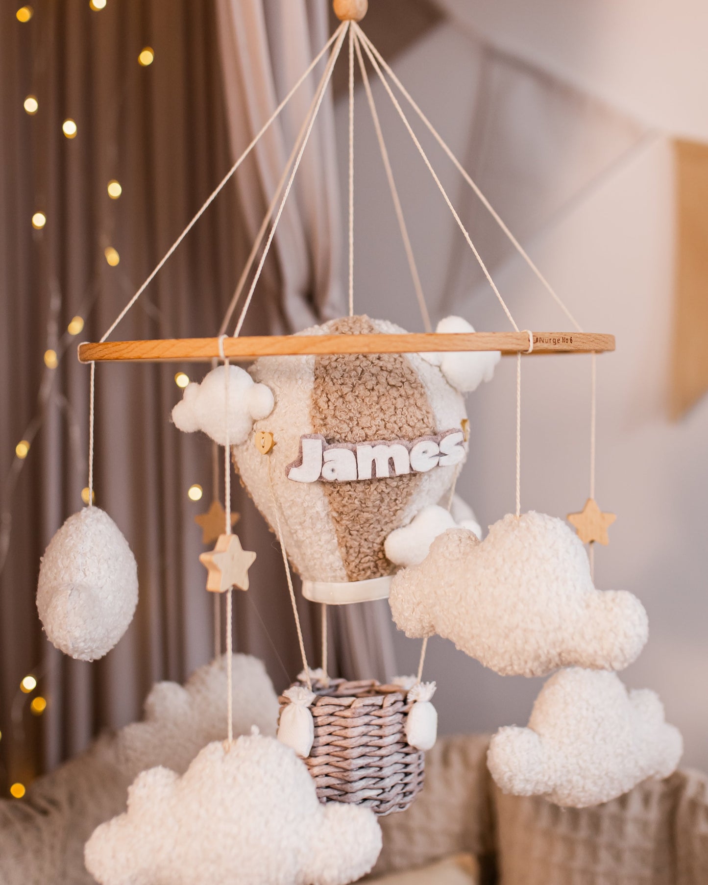 Personalized hot air balloon baby mobile with clouds and name over crib