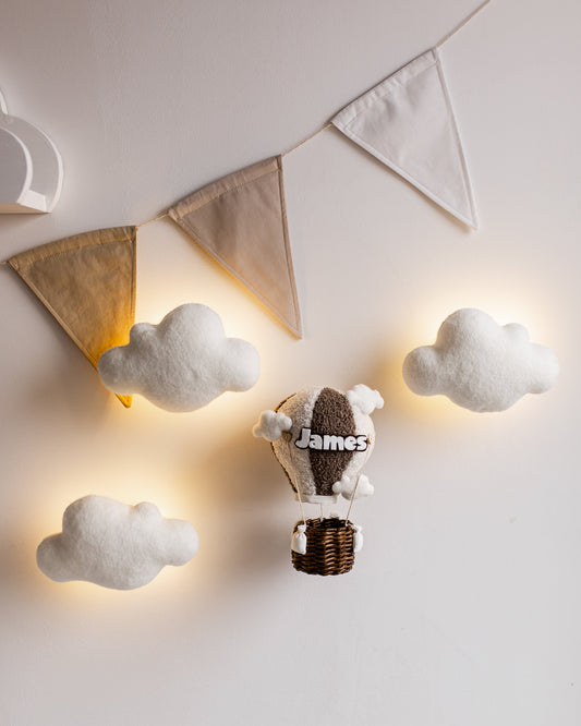 Boucle hot air balloon wall light set with clouds and LED glow, personalized