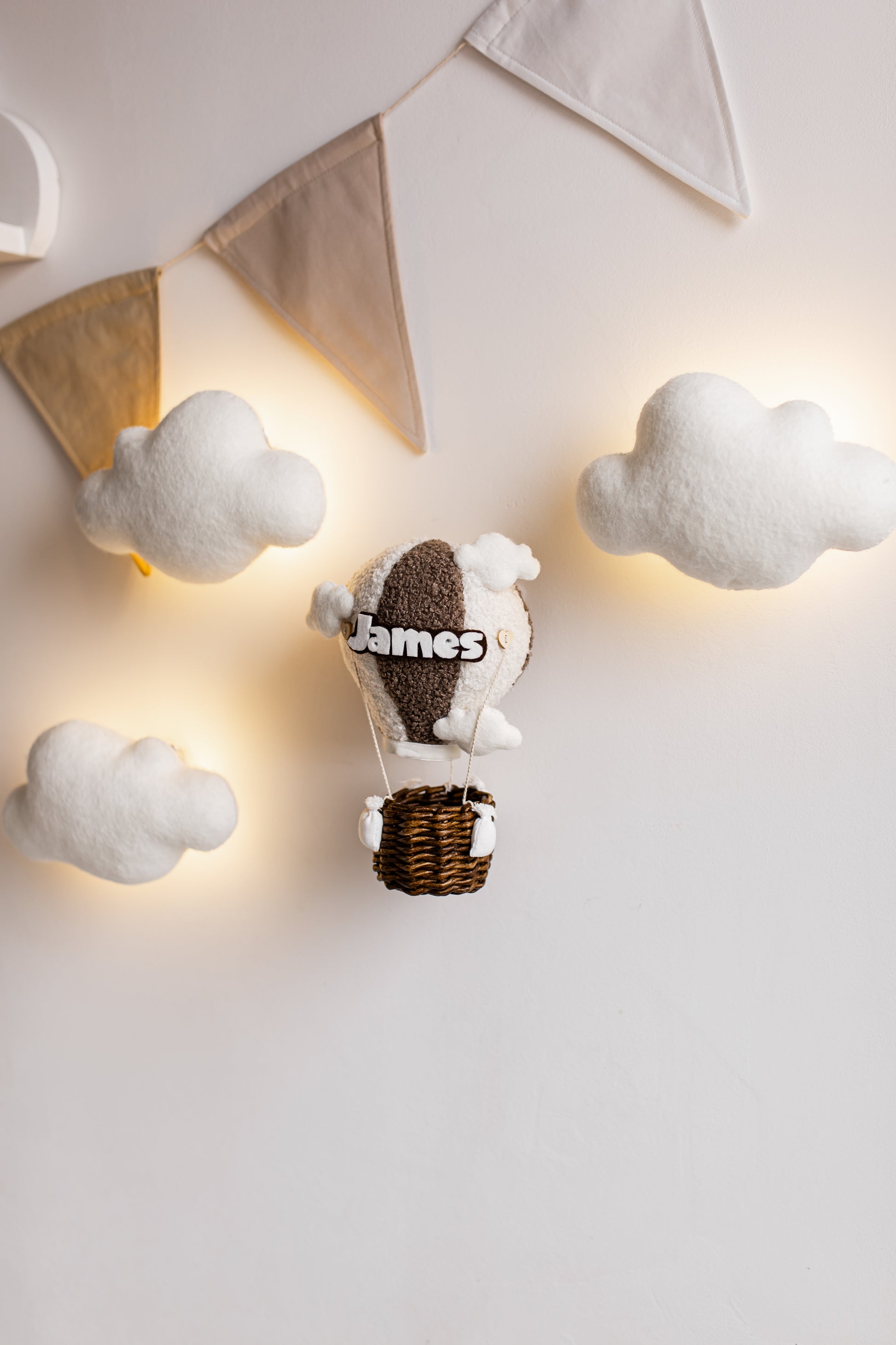 Cozy nursery wall light featuring hot air balloon and clouds with soft lighting
