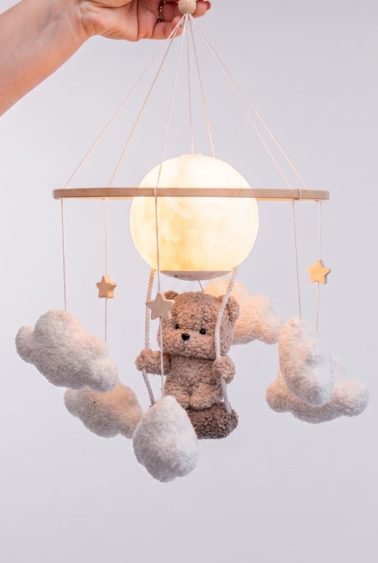 Nursery night light teddy bear on a swing baby crib mobile