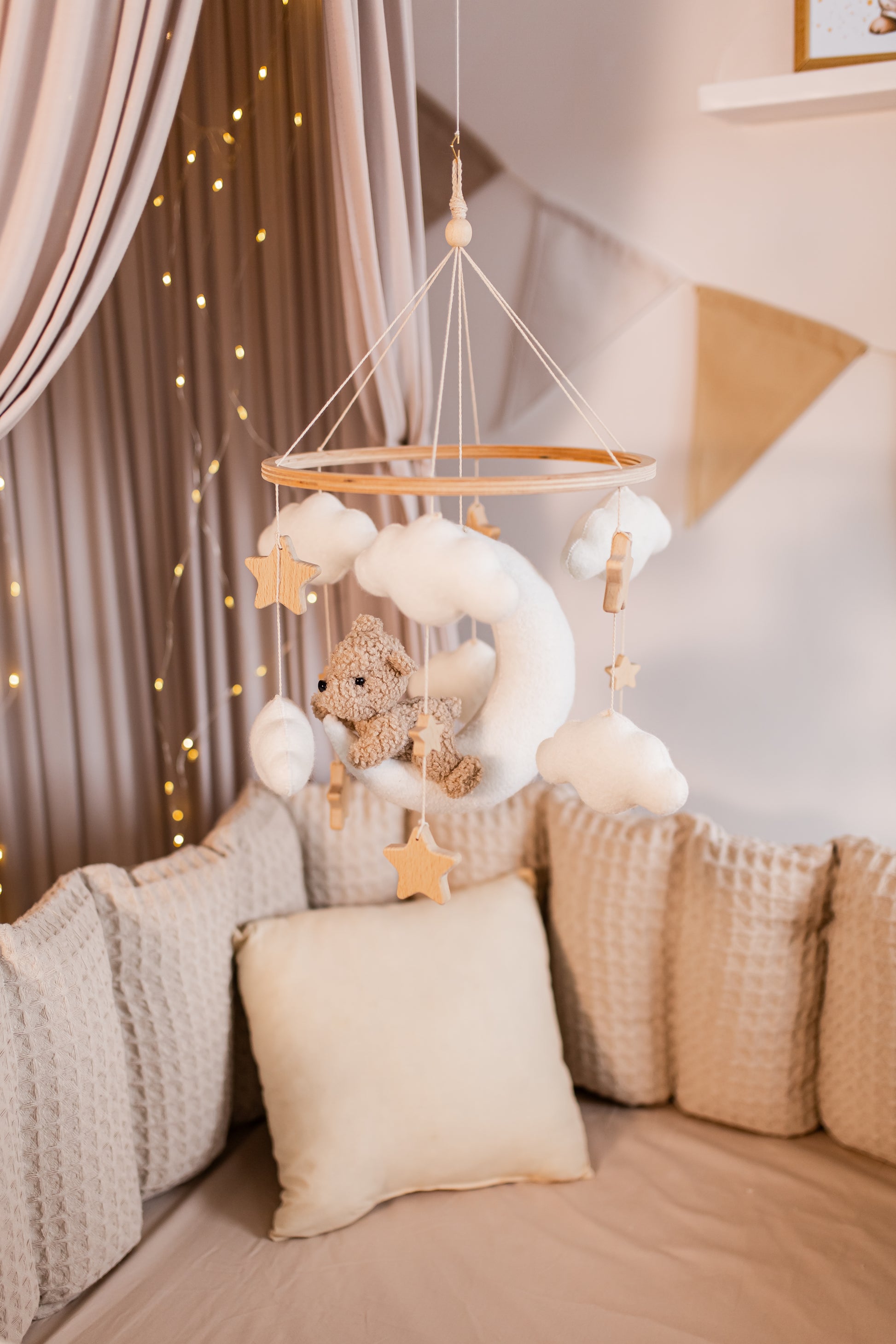 Handmade boucle moon bear mobile in soft neutral tones for nursery