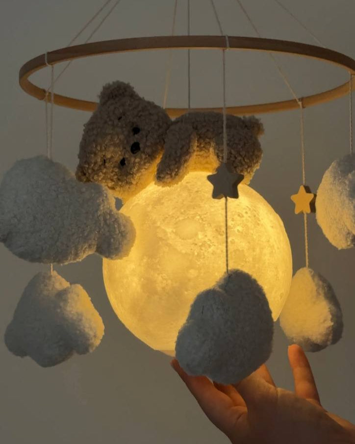 Bear on glowing moon baby night light mobile with soft boucle clouds