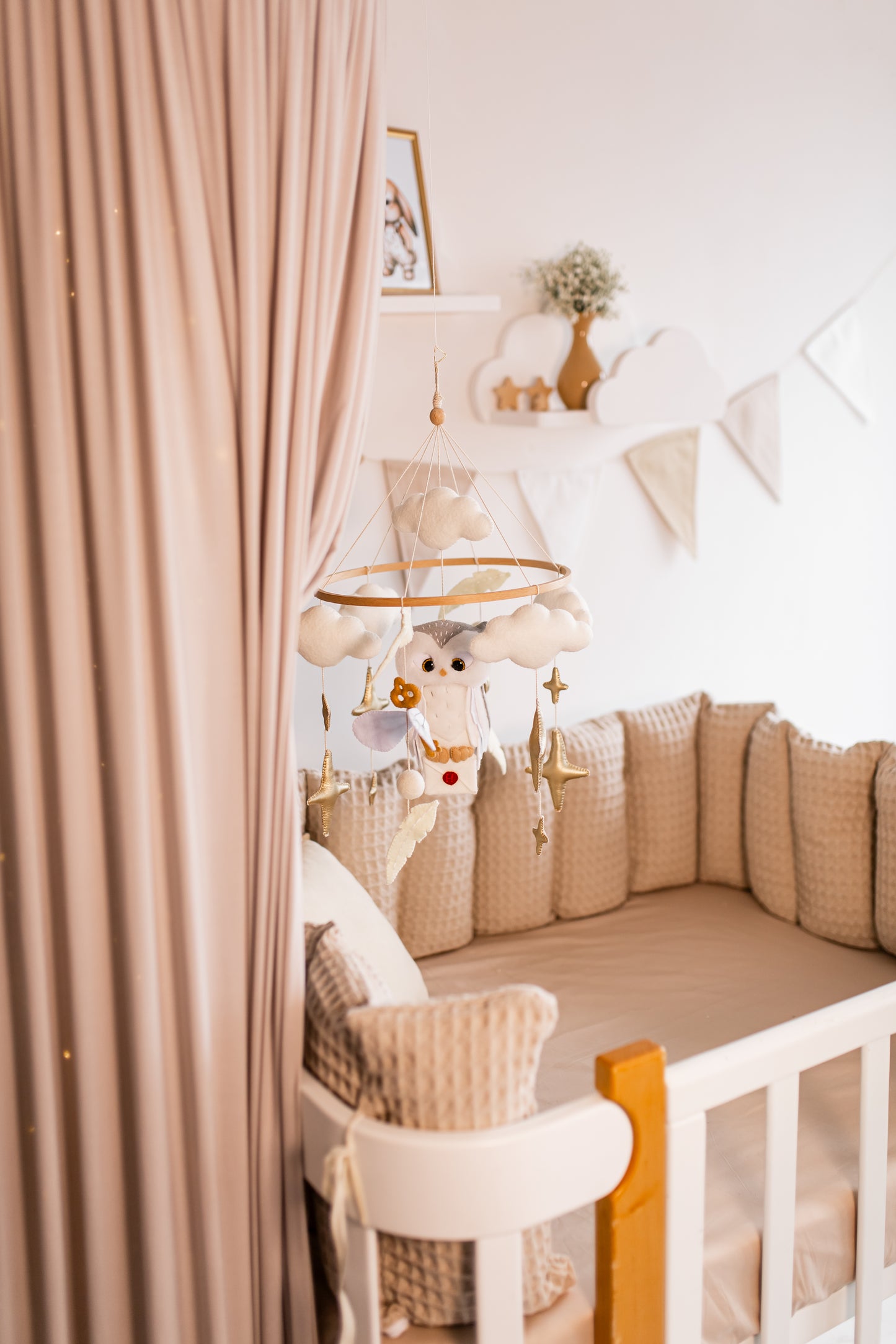 Nursery room with a crib, lamp, and decorative elements.