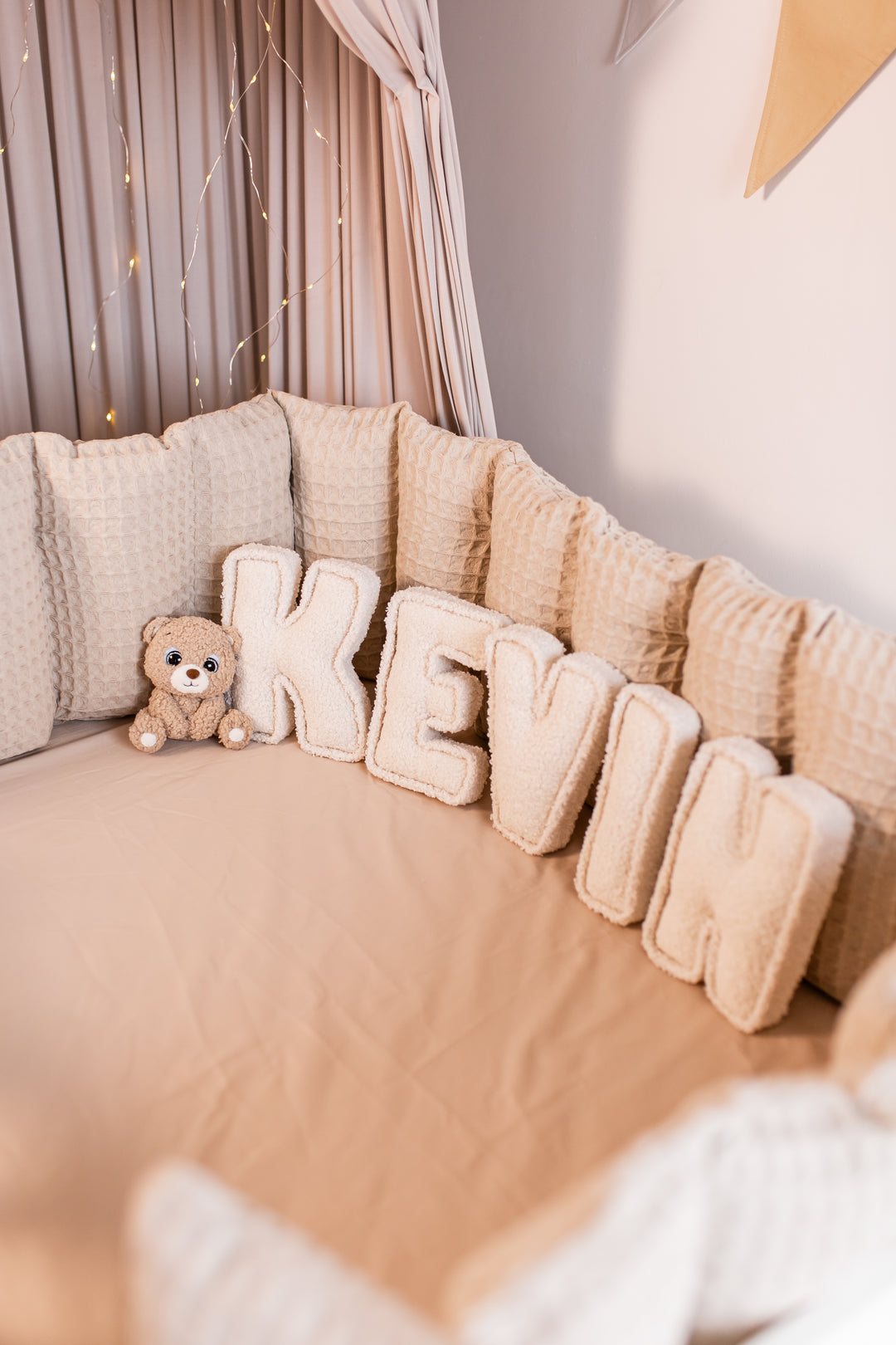Handmade bouclé letters with teddy bear accent for personalized baby room décor