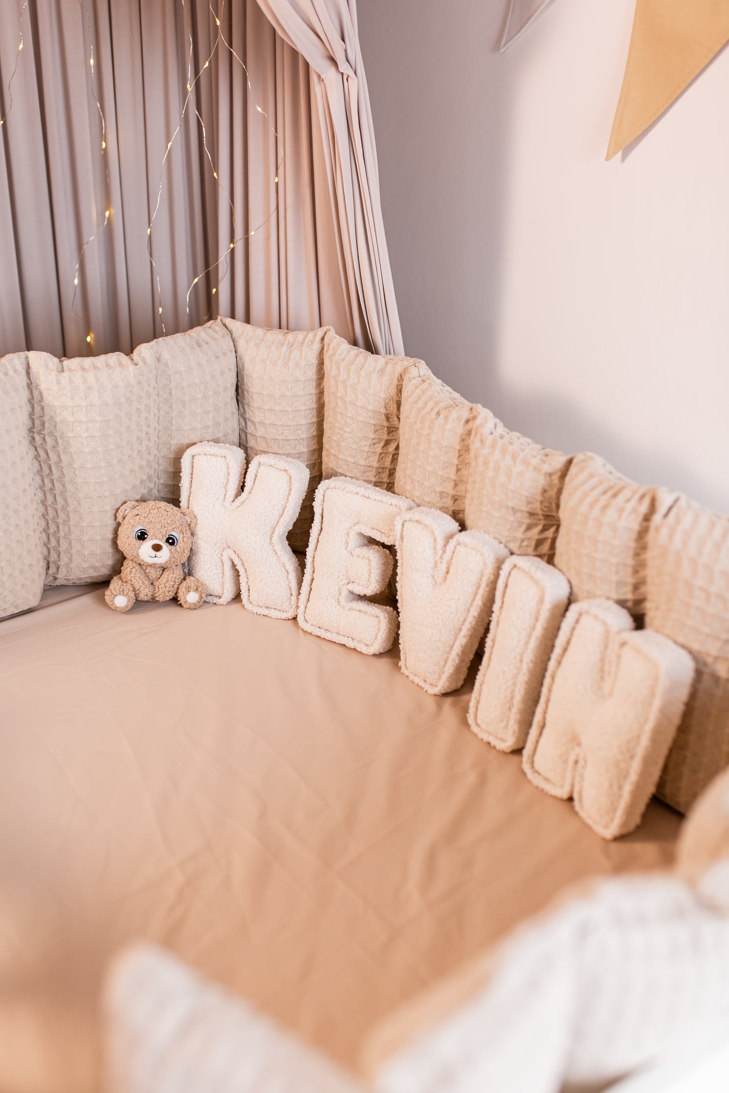 Handmade bouclé letters with teddy bear accent for personalized baby room décor