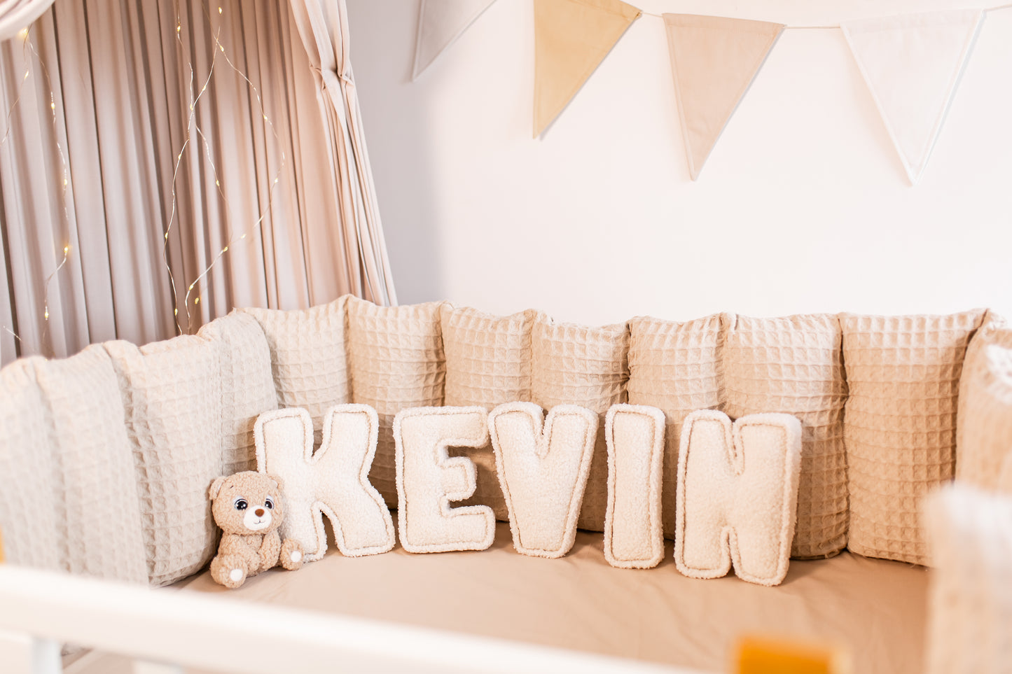 Customizable name decor in soft bouclé fabric for charming nursery wall accents