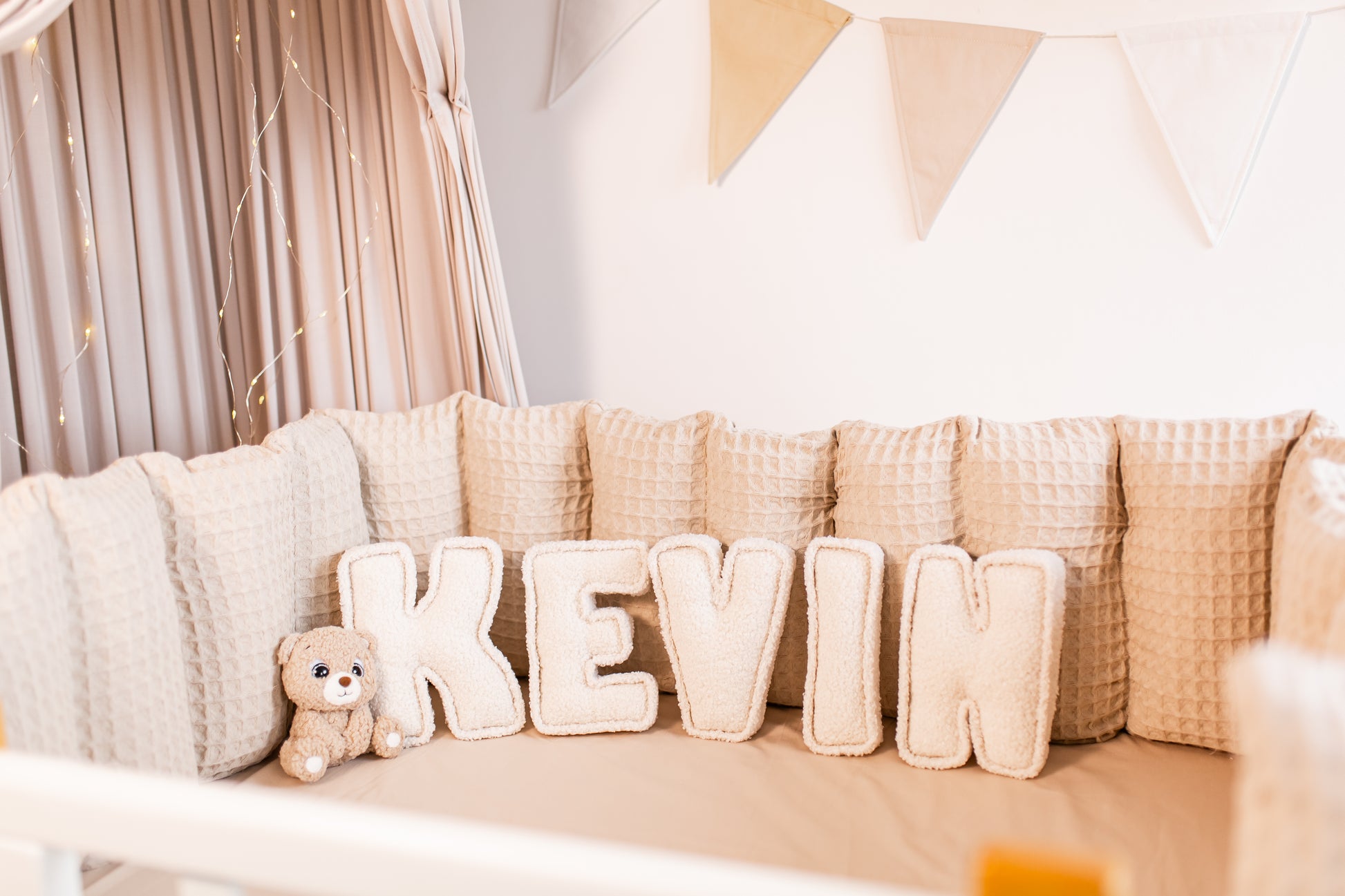 Customizable name decor in soft bouclé fabric for charming nursery wall accents