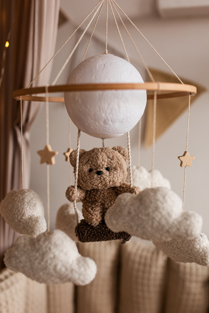 Nursery night light teddy bear on a swing baby crib mobile