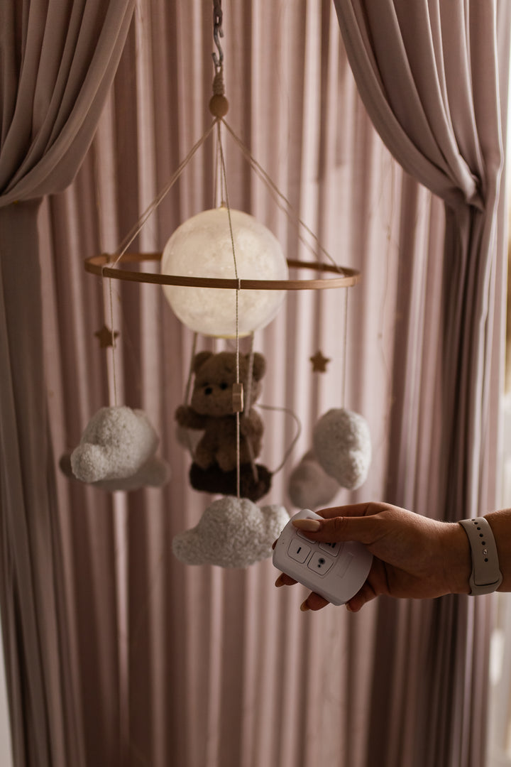 Nursery night light teddy bear on a swing baby crib mobile