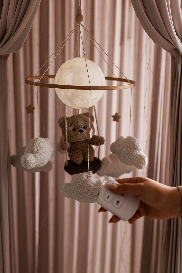 Nursery night light teddy bear on a swing baby crib mobile