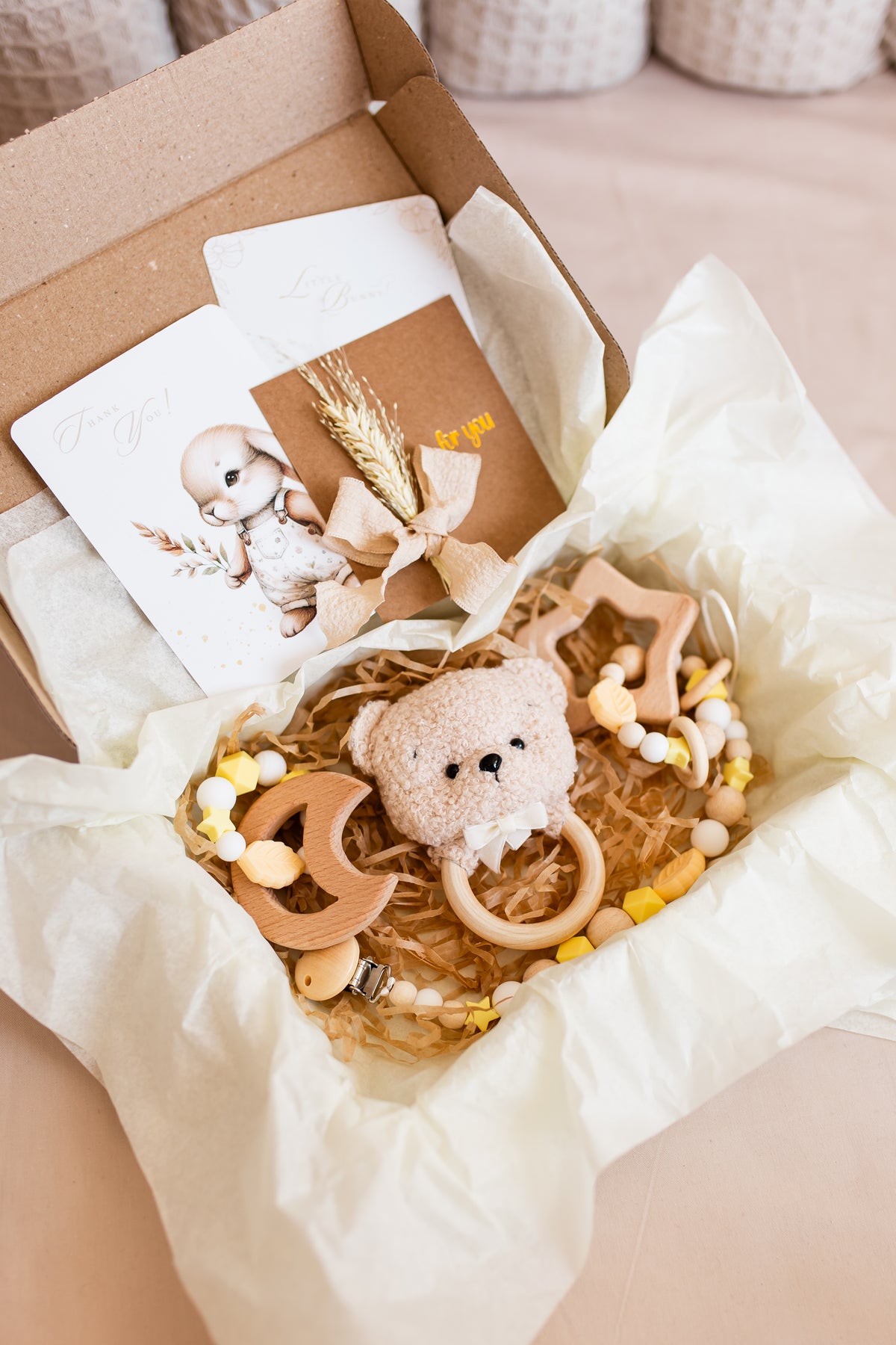 Gift set with teddy bear, teether, and card in a box