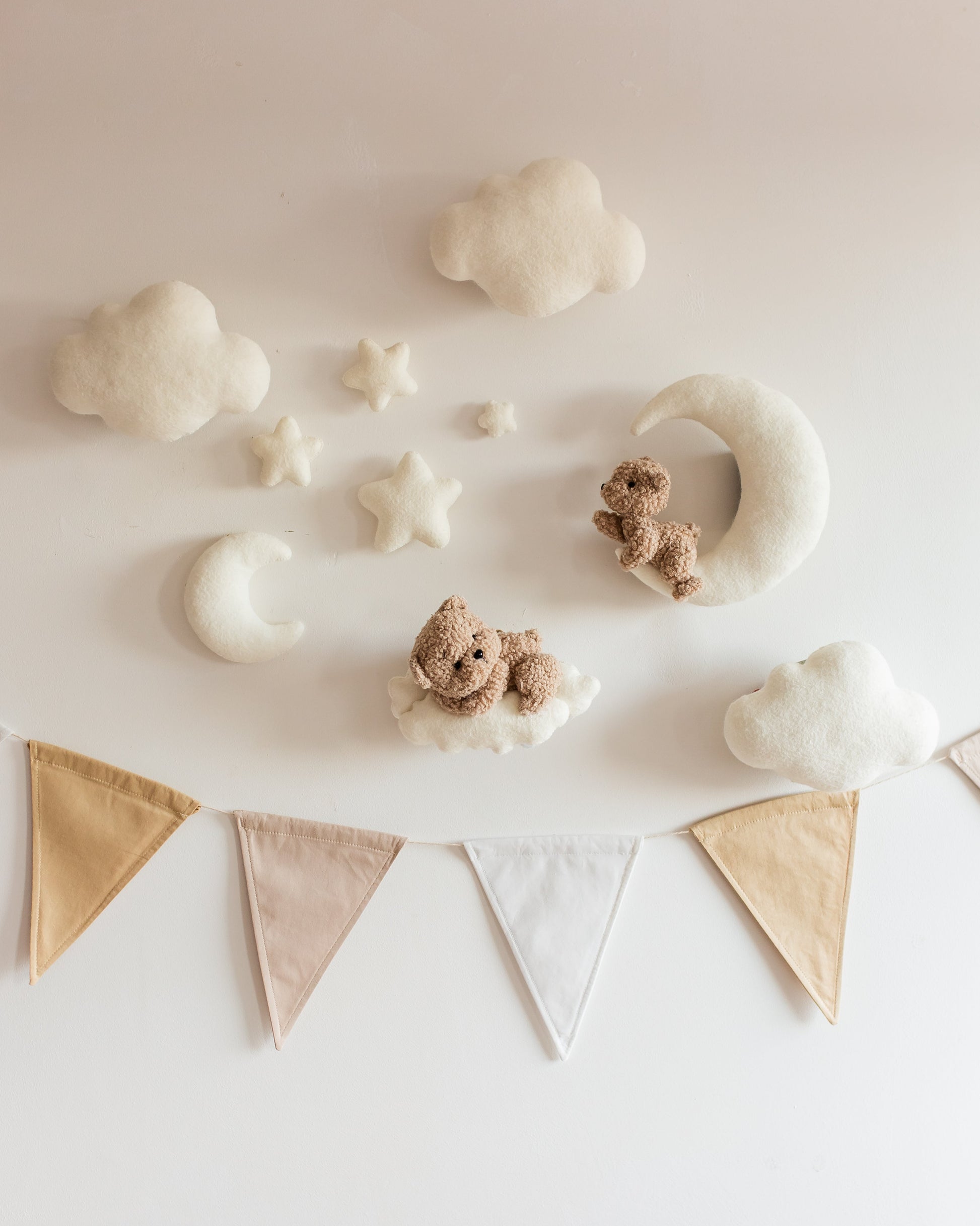 Bouclé two teddy bears wall décor set with clouds and stars near nursery crib